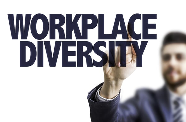 Business man pointing the text Workplace Diversity